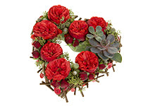 A fun and beautiful fresh heart arrangement is created with red Piano garden roses, succulents, aspidistra leaves, brunia, seeded eucalyptus, and red twig dogwood.