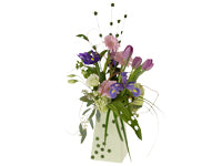 Small bouquets of spring flowers and foliages like purple iris, lavender tulips, pink Gerbera daisies, white lisianthus, aspidistra, and grasses with craft touches are a very popular gift.
