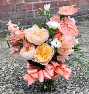 Wedding Bouquet features garden roses, anthurium, and sweet peas from our friends at Florabundance.com.