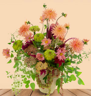 Garden-inspired design featuring foraged greenery and locally grown blooms