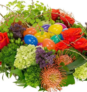 Colorful bouquet of flowers with Easter eggs on a white background