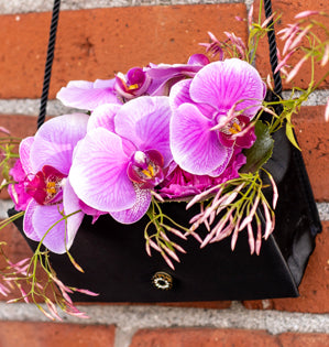 Purse filled with purple iris.