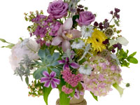 A Mille de Fleur or “One Thousand Flowers” design combines many multi-colored blossoms like peonies, roses, lisianthus, hydrangea, Gerbera daisies, callas, clematis, astrantia, hypericum, cymbidium orchids, and more.