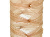A clear glass vase is wrapped in sheer blush colored ribbon in the style of a ballerina wrap.  It is a decorative ribbon technique that gets its name from the resemblance to the wrap used on dancer’s ankles in ballet pointe.