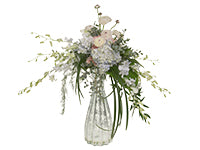 An elegant elevated centerpiece of soft purple hydrangea, rose quartz carnations, blushed ranunculus, ivory spray roses, Dendrobium orchids tinted a soft blue, eucalyptus foliage, large aspidistra leaves, plumosa, monstera, and Italian ruscus.