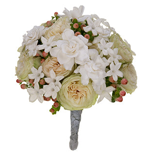 An elegant bridal bouquet using classic garden roses combined with fragrant gardenias, stephanotis and hypericum berries.