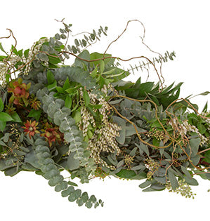 A garland of mixed foliages includes baby eucalyptus, salal, bay leaves, Lily of the Valley, Italian ruscus, andromeda, fatsia, and curly willow.