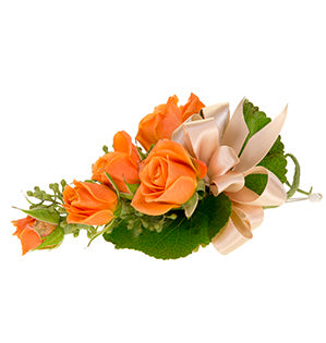 A formal line corsage of orange spray roses.