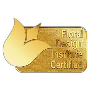 This gold lapel pin with a tulip on it is awarded to Floral Design Institute graduates who achieve FDI certification.
