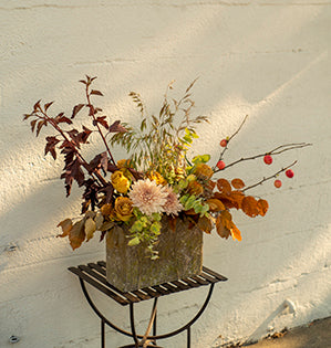 A lush foam free arrangement for the home combines roses, chrysanthemums, eucalyptus and crabapples in fabulous fall colors.
