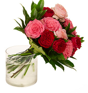 Tess, Kiara, and Ashley roses in red, blush pink, and dark pink are a beautiful way to create a Valentine's Day spiral bouquet, especially when mixed with Israeli ruscus and fatsia leaves.