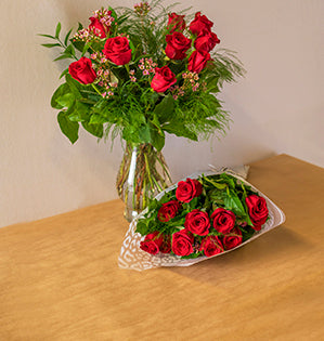 A classic vase design mixes stunning red roses with fabulous foliage for a beautiful effect.
