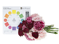 A monochromatic color scheme is composed of the tints, tones and shades of a single color hue. Illustrating this is a beautiful bouquet which mixes variegated carnations with pink and burgundy roses.
