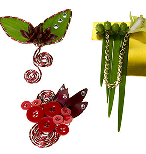 Four different Brilliant Boutonnieres mix flowers and foliage like orchids, succulents, Israeli ruscus, and berries with a little bling for stylish and contemporary prom looks. 