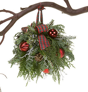 This Christmas Kissing Ball is filled with evergreens, pine cones, colorful ornaments, and festive ribbon for a beautiful effect.