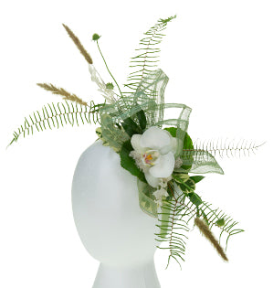 A fantastic floral fascinator combines fresh, dried, and preserved materials with one fabulous white Phalaenopsis orchid bloom.