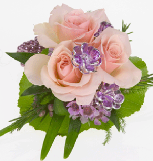 A traditional corsage mixes galax leaves, spray roses, waxflower, and lily grass along with some gems for sparkle.